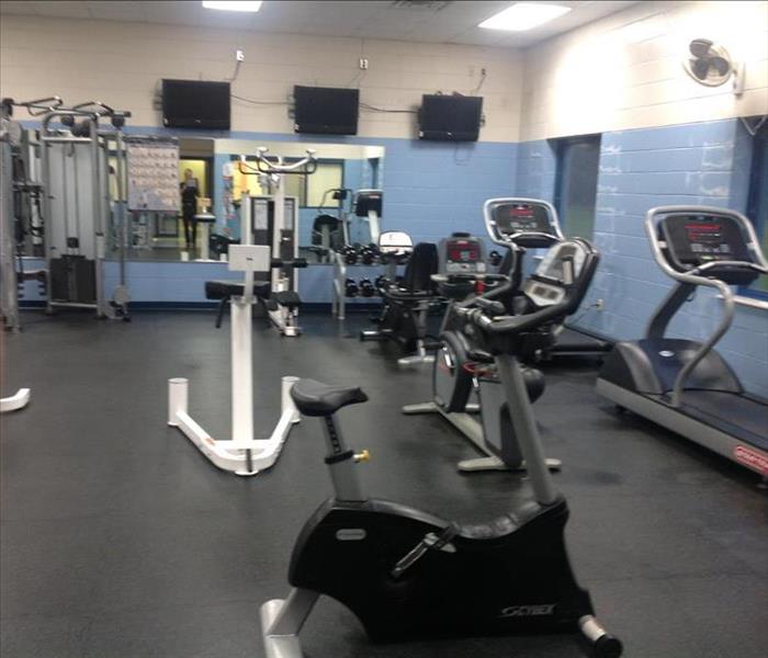 gym with equipment and black flooring