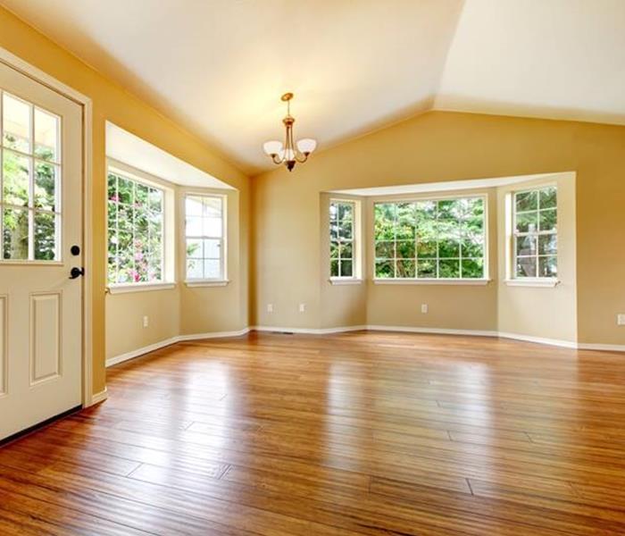 room with tan walls and hardwood flooring