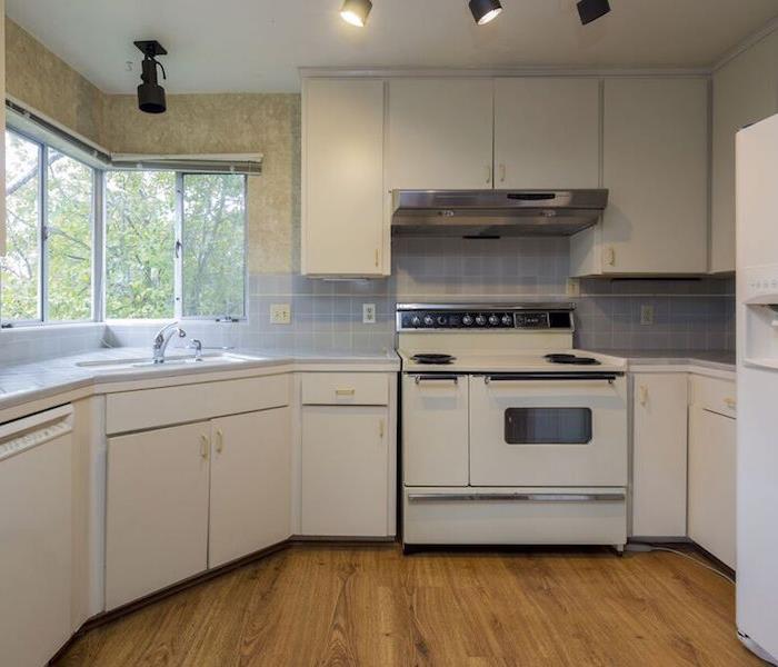 kitchen with white cabinets and a white tile backsplash