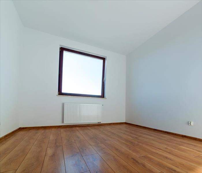room with white walls and hardwood flooring