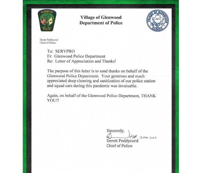 A letter with a green border from a police department.