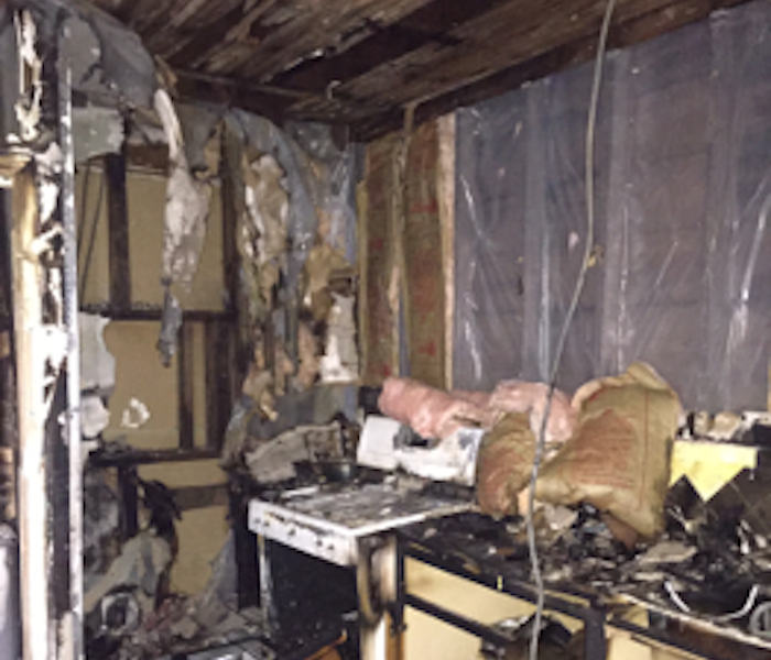 kitchen covered with burned debris