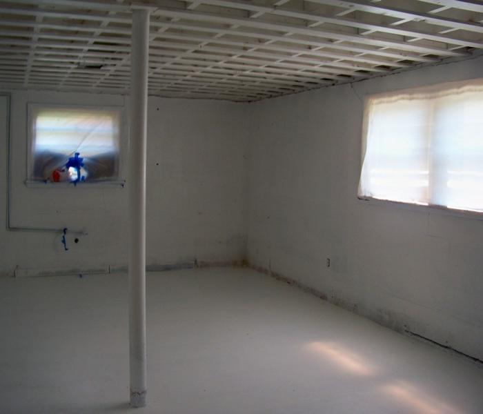 basement covered in white anti-microbial paint to protect the structure from mold damage