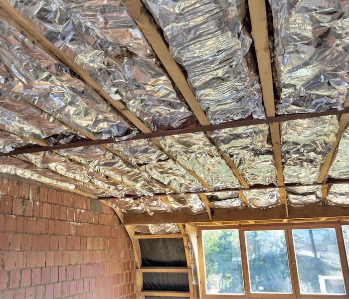 ceiling with wood framing and insulation exposed
