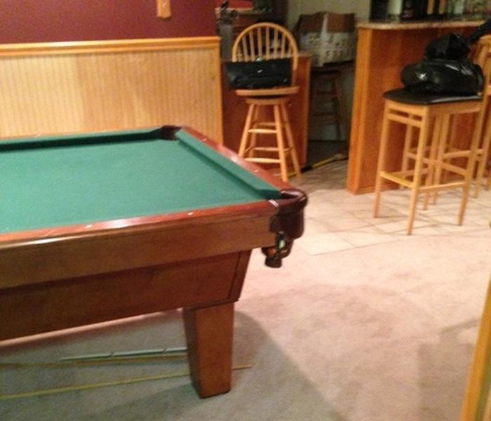 basement with tan carpet and a pool table