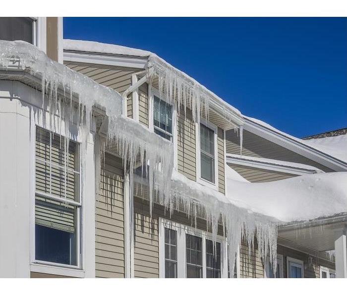 icicles along the roof line of a home