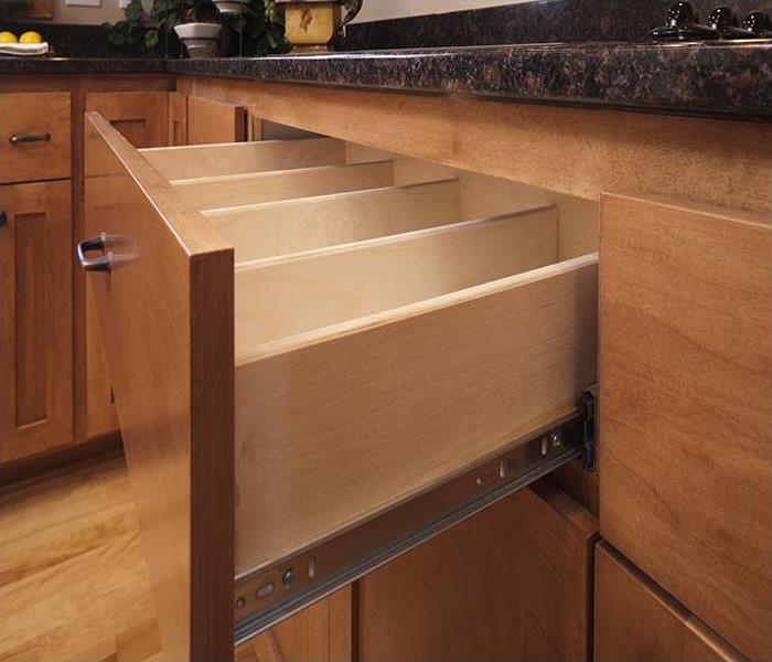 wood cabinets with a drawer open